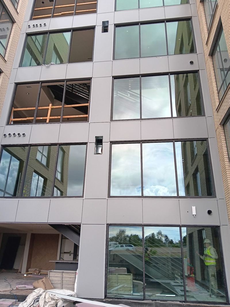 Glazing installed across several storeys of a commercial building facade