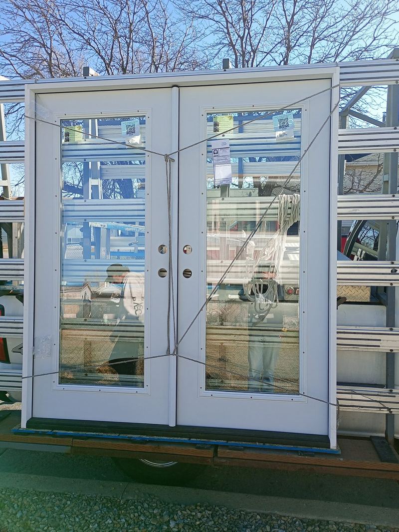 A pair of glazed commercial entrance doors ready to install